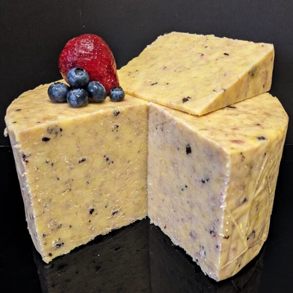 a wheel of Berry Vanilla cheese flavored with strawberries, blueberries and vanilla