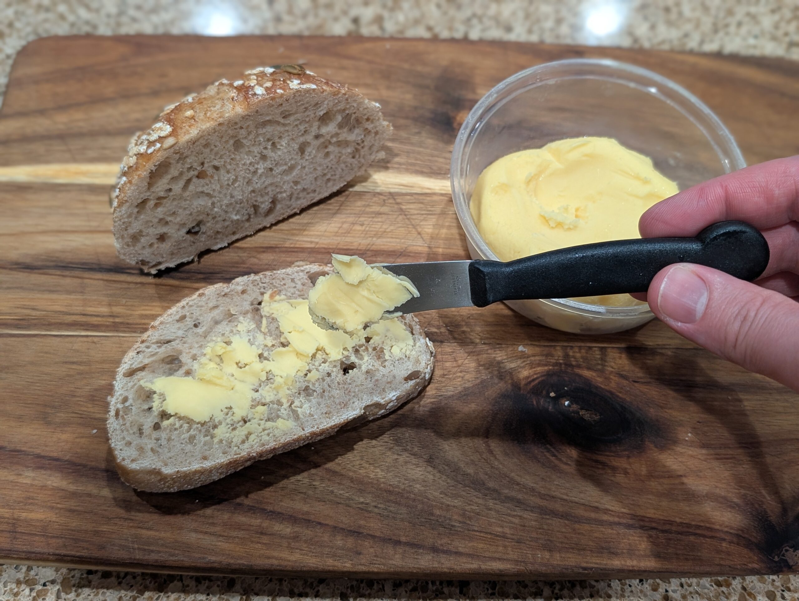 homemade butter on a slice of artisan bread