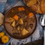 a bowl of beef cubes and potato stew