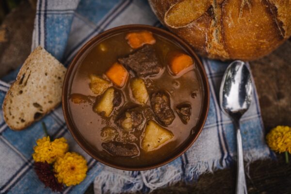 a bowl of beef cubes and potato stew